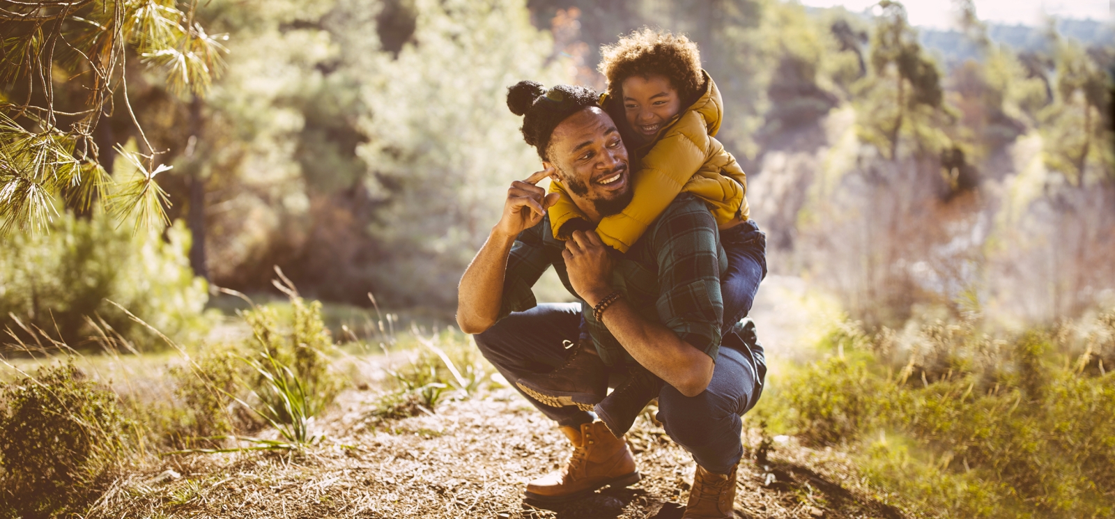 Father and son hiking in woods